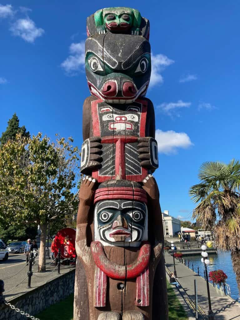close up of a totem pole in victoria's inner harbor
